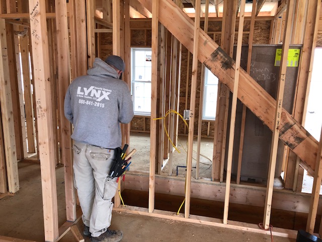 One of our LYNX electricians at work in a new construction site